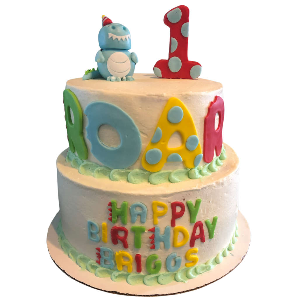 Two tier buttercream birthday cake with a fondant dinosaur topper and ROAR lettering