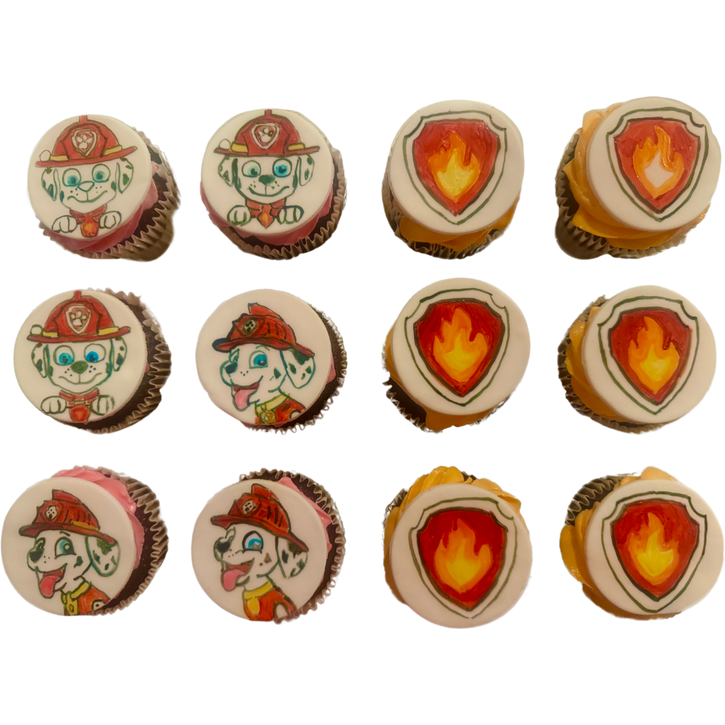 Cupcakes topped with hand-painted fondant discs showing a cartoon pup and a fire badge