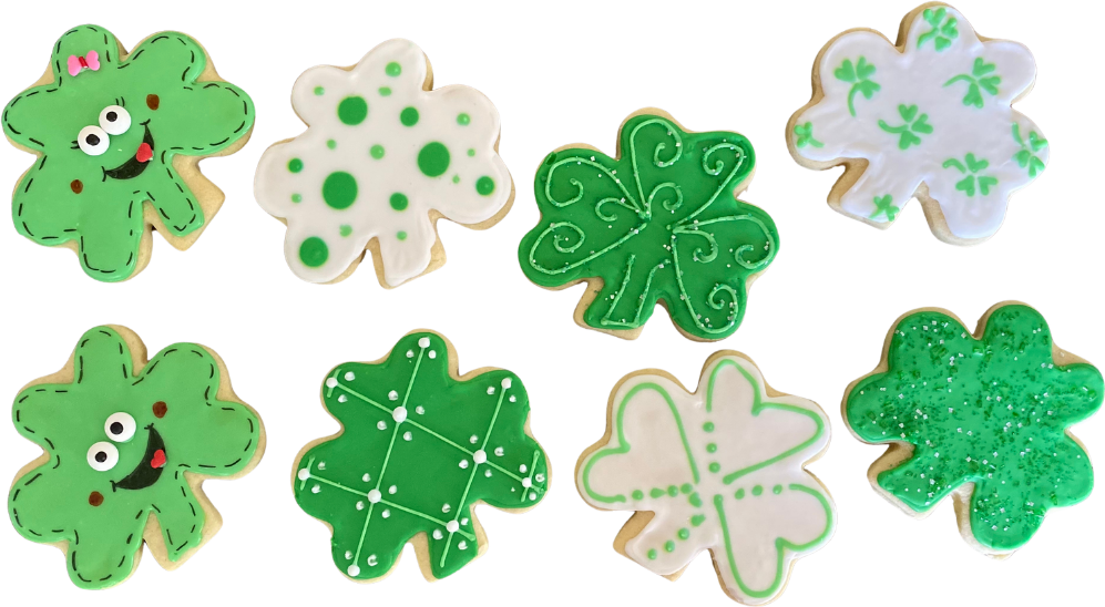 St. Patrick's Day shamrock cookies decorated in green and white