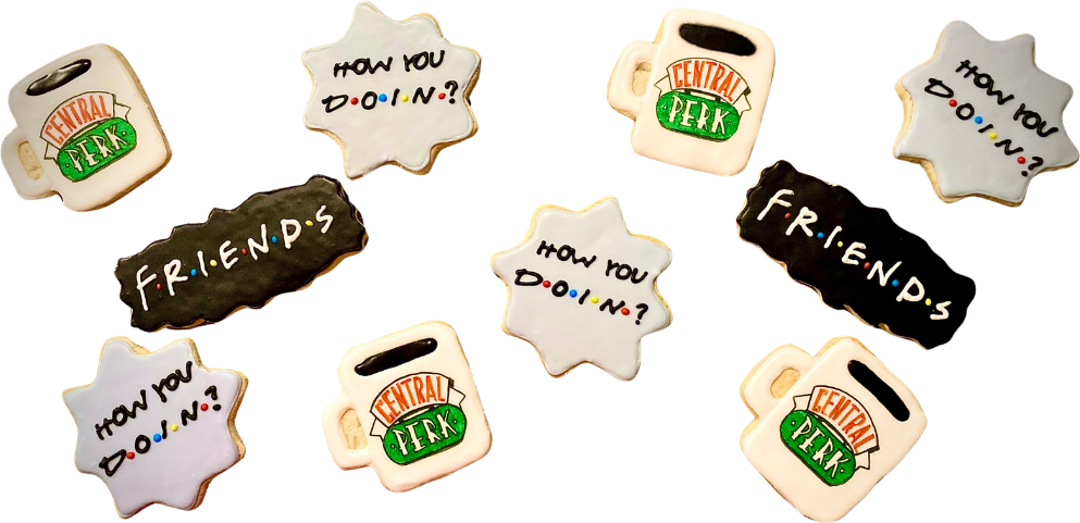 Cookies shaped like coffee mugs and speech bursts for a sitcom themed party