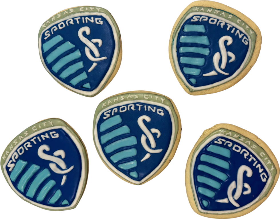 Sporting Kansas City crest cookies in navy, light blue and sage green